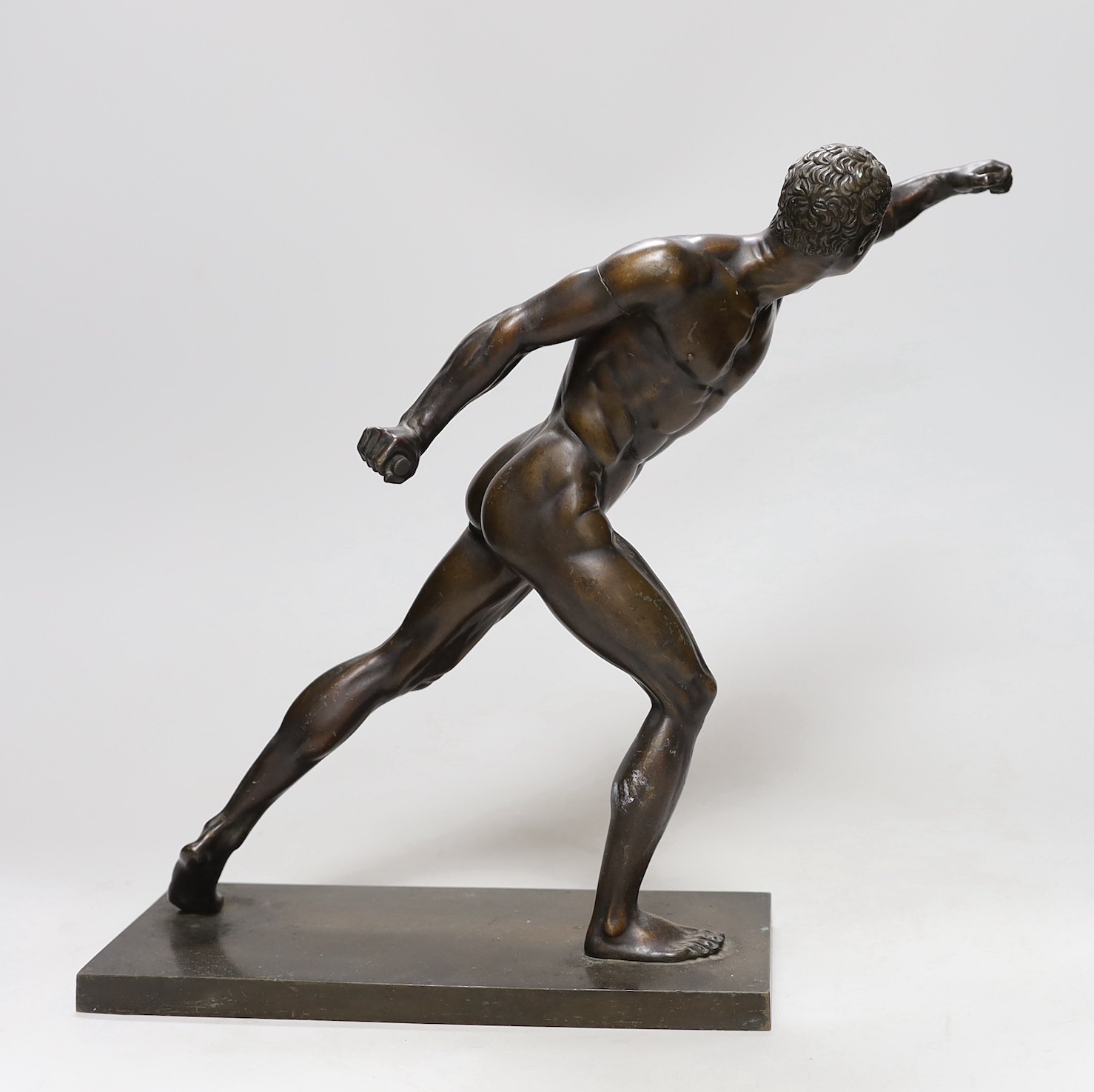 After the Antique, a late 19th/early 20th century bronze figure of an athlete, 32cms high